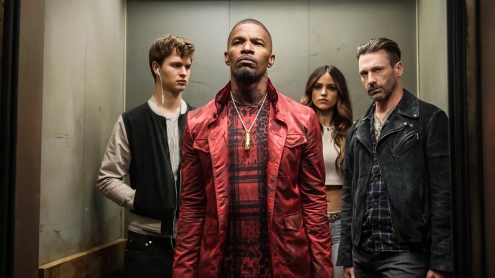 The cast of Baby Driver standing in an elevator.